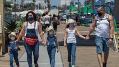 Family wearing masks