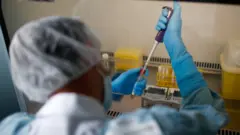 Doctor with syringe