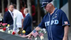 নিহতদের প্রতি শ্রদ্ধা জ্ঞাপন করচেন একজন নাগরিক।