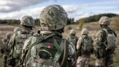 військові