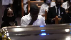 Mourners at George Floyd's coffin in Houston, 9 June