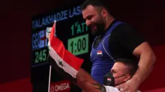Man Asaad of Team Syria competes during the Weightlifting - Men's 109kg+ Group A on day twelve of the Tokyo 2020 Olympic Games at Tokyo International Forum on August 04, 2021 in Tokyo, Japan