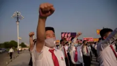 North Korean students take part in a rally denouncing "defectors from the North" as they march from the Pyongyang Youth Park Open-Air Theatre to Kim Il Sung Square in Pyongyang on June 8, 2020.