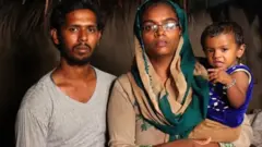 குழந்தை ஷுபானாவுடன் அவரது பெற்றோர்