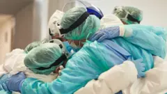 view of hard working male and female hospital team