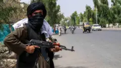 A Taliban fighter on patrol in Kandahar