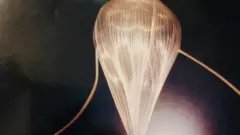 The weather balloon being inflated at launch