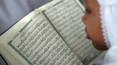 A student in Medan, Indonesia reads the Koran
