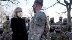 U.S. first lady Jill Biden surprises National Guard members outside the Capitol with chocolate chip cookies