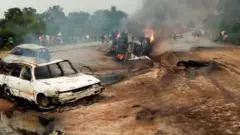 cars burn for di explosion