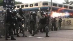 Riot police fire the tear gas while protesters take part in an anti-government march in Kwun Tong, Hong Kong, China, 24 August 2019.