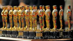 A series of Oscar statuettes