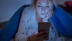 woman using her mobile phone