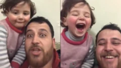 أب سوري وابنته يضحكان على صوت القذائف