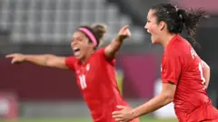 Jessie Fleming celebrates
