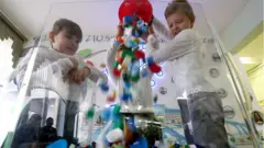 Children recycling plastic