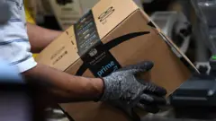 Amazon box being handled at a warehouse
