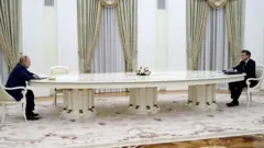 Putin (left) and Macron (right) meet in Moscow