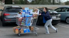 A woman leaving a supermarket in California