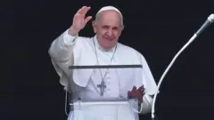 The Pope dey wave from di window of im study wey dey overlook St Peter's Square for di Vatican on July 4, 2021