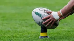Rugby league ball on a kicking tee