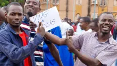 Coup supporters on the streets of Niamey after the army seized power in Niger