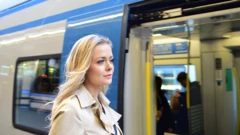 Young woman getting into a train in Sweden