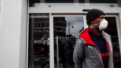 Photo of man outside shop