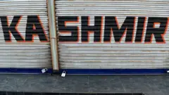 A closed shop is pictured during curfew in Srinagar on August 7, 2019.