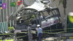 Wrecked bus in Karachi, May 2002