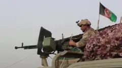 Afghan security personnel fighting against the Taliban in the outskirsts of Kunduz city. 12 July 2021