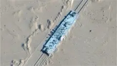 A satellite image shows a mock-up US military ship in the desert in Xinjiang, north-western China