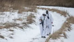 Ukrainian border guards patrol in Chernihiv region near the Russian border