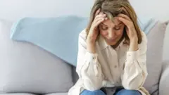 Woman with Covid symptoms at home