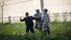 9. Minnesota national guardsmen disperse demonstrators during protests resulting from the killing of an unarmed black man, George Floyd, by police
