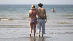 Couple walking on a beach