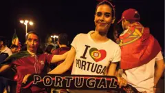 Woman dey hold Portugal banner