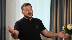 Zelenski sedi