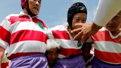 Members of Tokyo's Fuwaku Rugby Club train outdoors