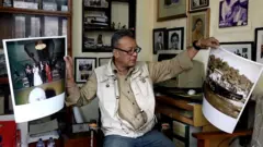 पुराना फोटा देखाउँदै किरणमान चित्रकार।