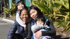 Lien Tran with her mum and children