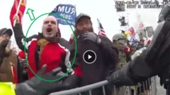 Thomas Webster holding a flag during the attack