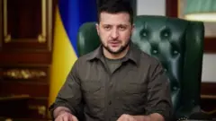 A handout photo made available by the Ukrainian Presidential Press Service shows Ukrainian President Volodymyr Zelensky during a broadcast speech in Kyiv (Kiev), Ukraine, late 21 March 2022 (issued 22 March 2022),