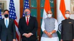 US Secretary of State Mike Pompeo (2nd L), US Secretary of Defence Mark Esper (L), India's Defence Minister Rajnath Singh (2nd R) and India's Foreign Minister Subrahmanyam Jaishankar pose for pictures before their meeting at Hyderabad House in New Delhi on October 27, 2020.