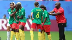 Cameroon coach Alain Djeumfa (right) dey encourage team to continue afta VAR say Ajara Nchout's goal na offside