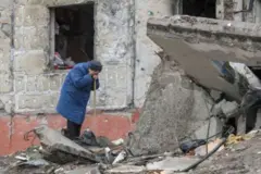 Despair as a woman tries to find her son's body in the town of Borodyanka