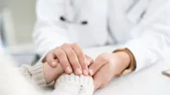 Female doctor with patient, file pic