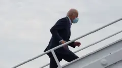 Joe Biden boards plane