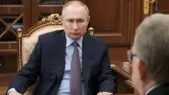 Russian President Vladimir Putin attends a meeting with Accounts Chamber Chairman Alexei Kudrin at the Kremlin in Moscow, Russia March 23, 2021.