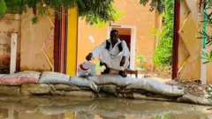man in sudan floods